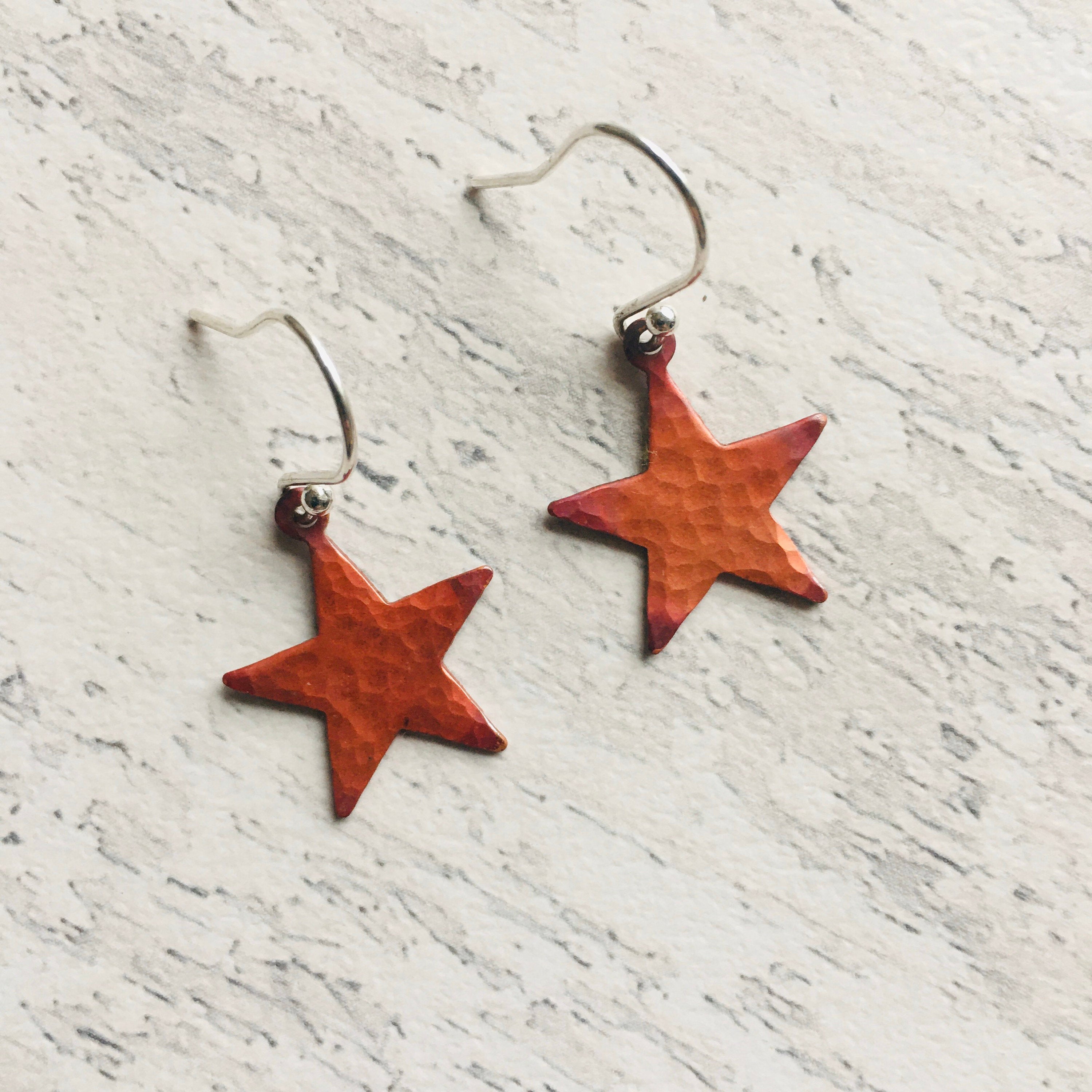 Star Earrings in red patinated copper, and, sterling silver ear findings.