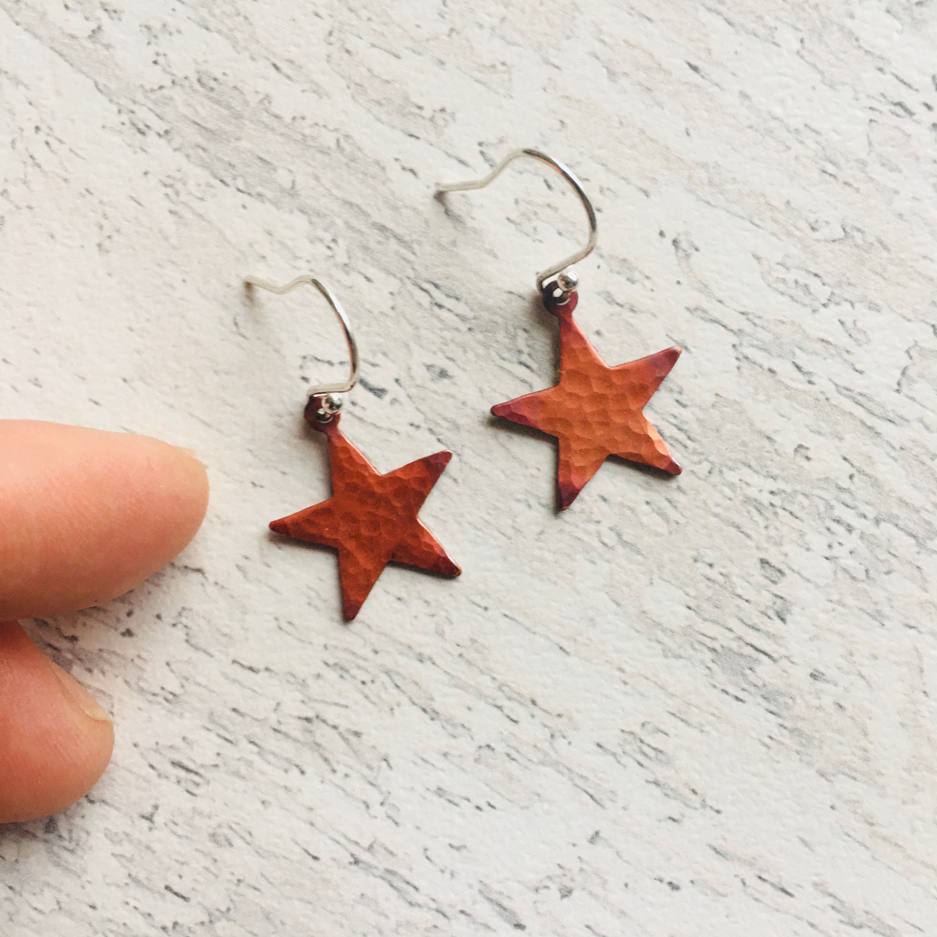 Star Earrings in red patinated copper, and, sterling silver ear findings.