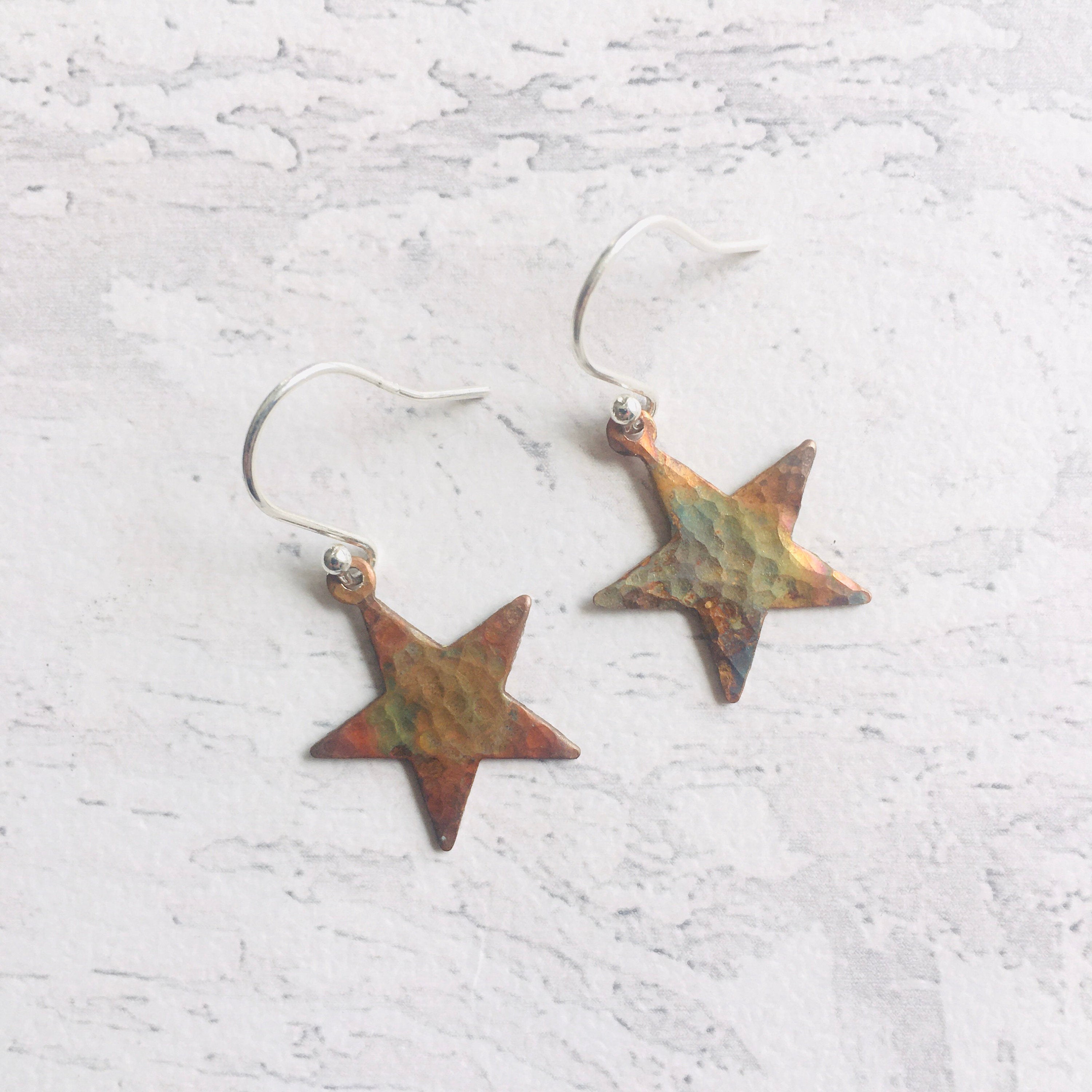 Star Earrings, heat patinated copper with rainbow colours. Easily worn with silver ear findings.